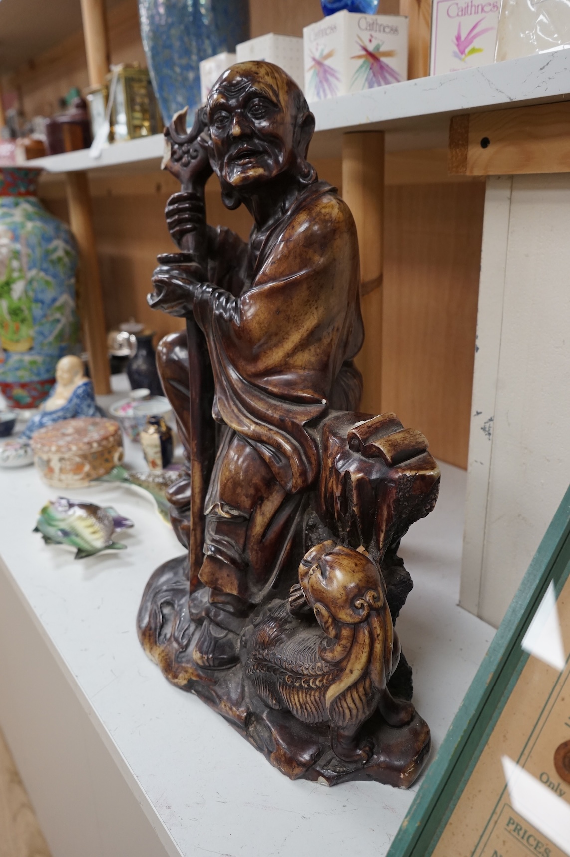 A large Chinese soapstone figure of a Luohan, 49cm
